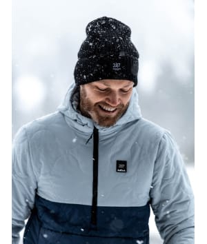 man in snow fall wearing 2117 black knitted cap 1