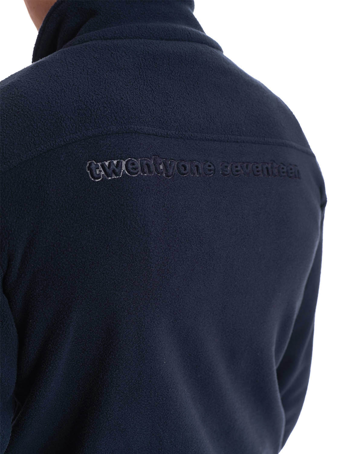 man wearing navy micro fleece jacket back heatprint 1