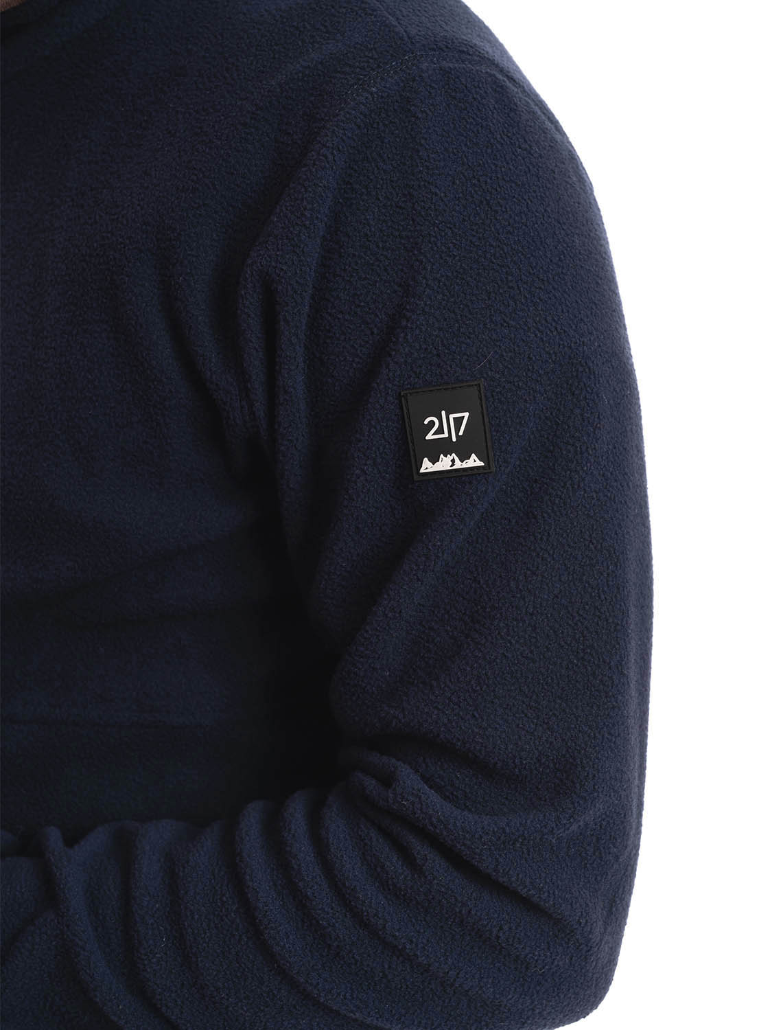 man wearing navy micro fleece jacket badge 1