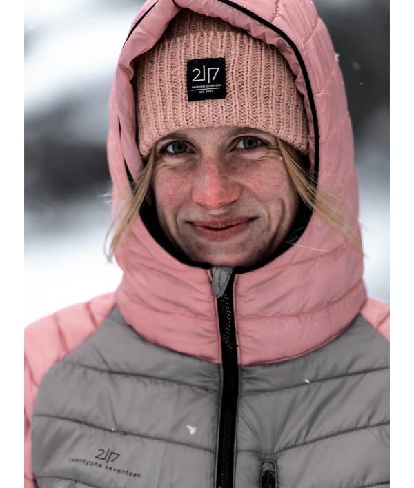woman wearing 2117 pink knitted cap under hood 1