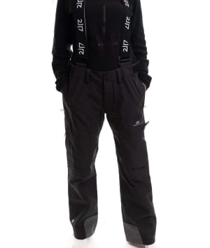 woman wearing black 3 layer ski pants