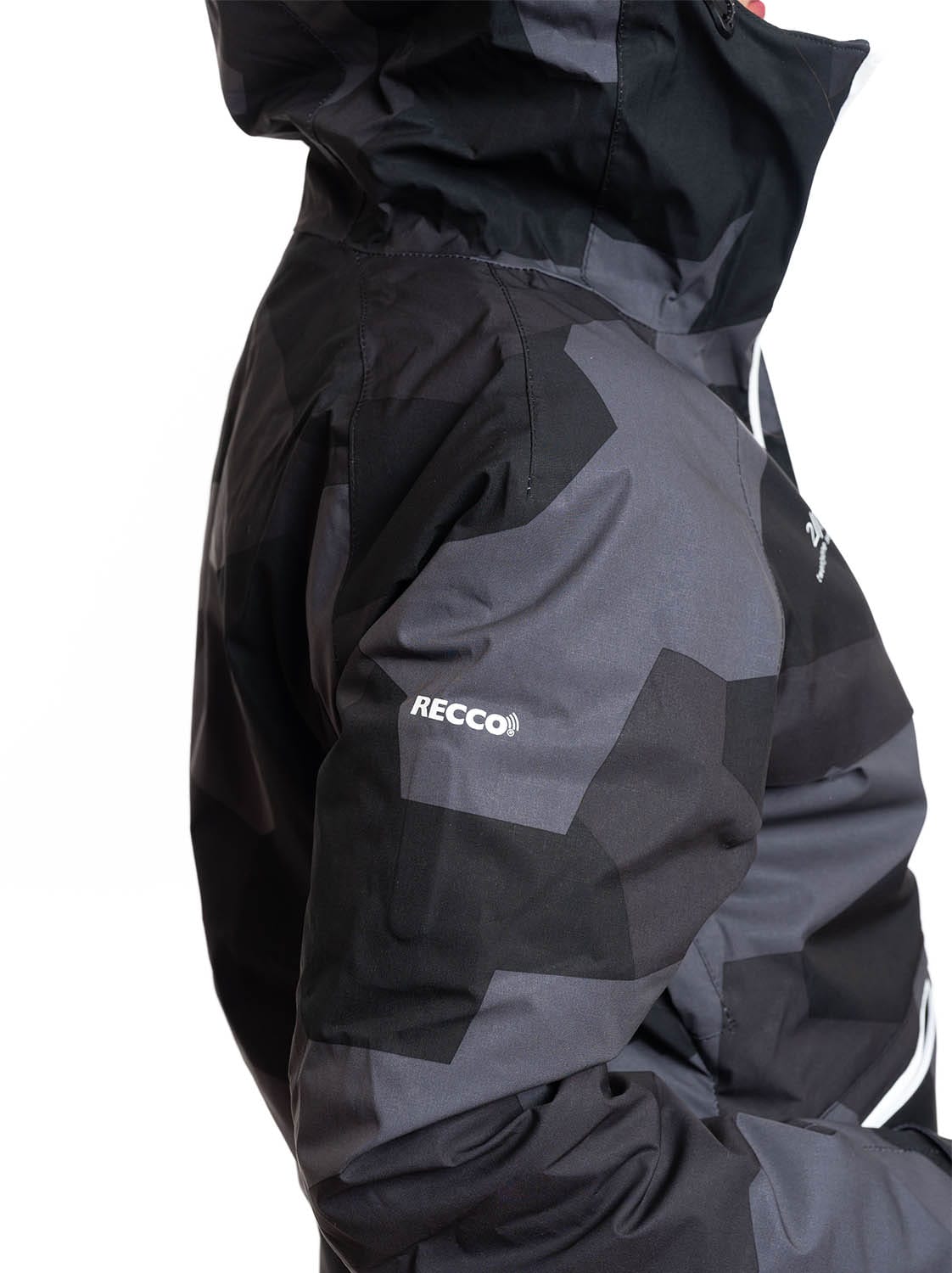 woman wearing black camo light padded ski jacket recco