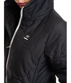 woman wearing black light padded jacket badge